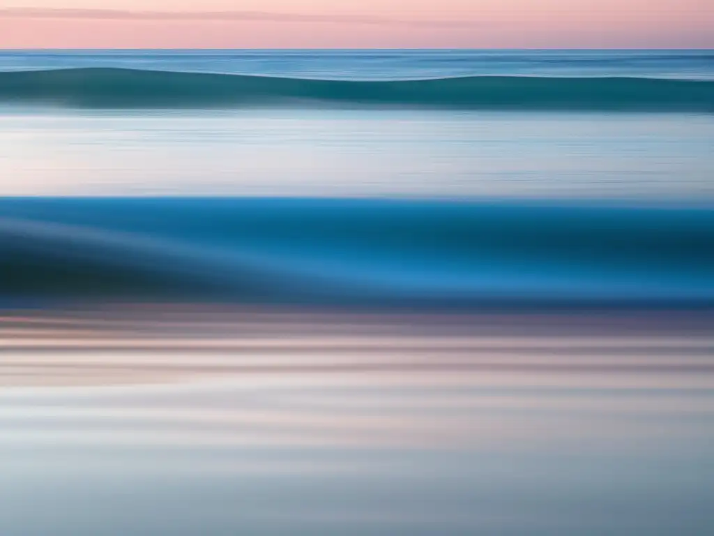 Importancia inteligencia emocional en el trabajo: serena imagen del océano azul con suaves olas y cielo pastel